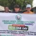 Persons with Albinism holding an event flex banner along with Mr Onah