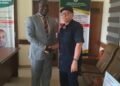 Picture of Dr. Paul Ogwuche and Adeyi Onah Daniel shaking hands